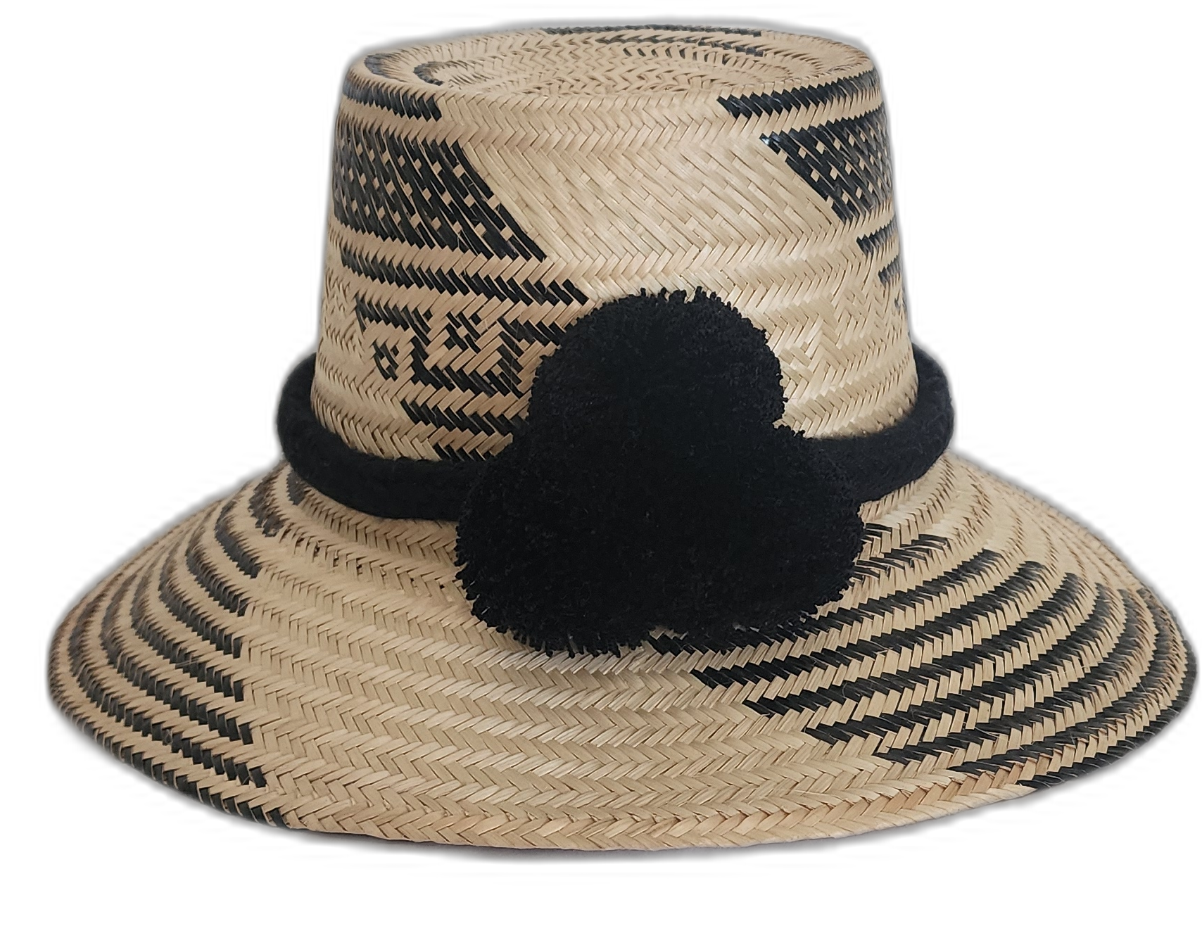 Handmade Wayuu straw hat with black tribal pattern and black pompoms