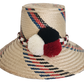 Handmade Wayuu straw hat with red, black, and blue diagonal patterns