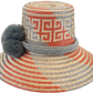 "Handmade Wayuu hat crafted from Iraca palm fibers, adorned with culturally significant pompoms, showcasing unique Wayuu craf