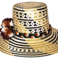 "Handmade Wayuu hat crafted from Iraca palm fibers, adorned with colorful pompoms, showcasing artisanal Colombian and Venezue