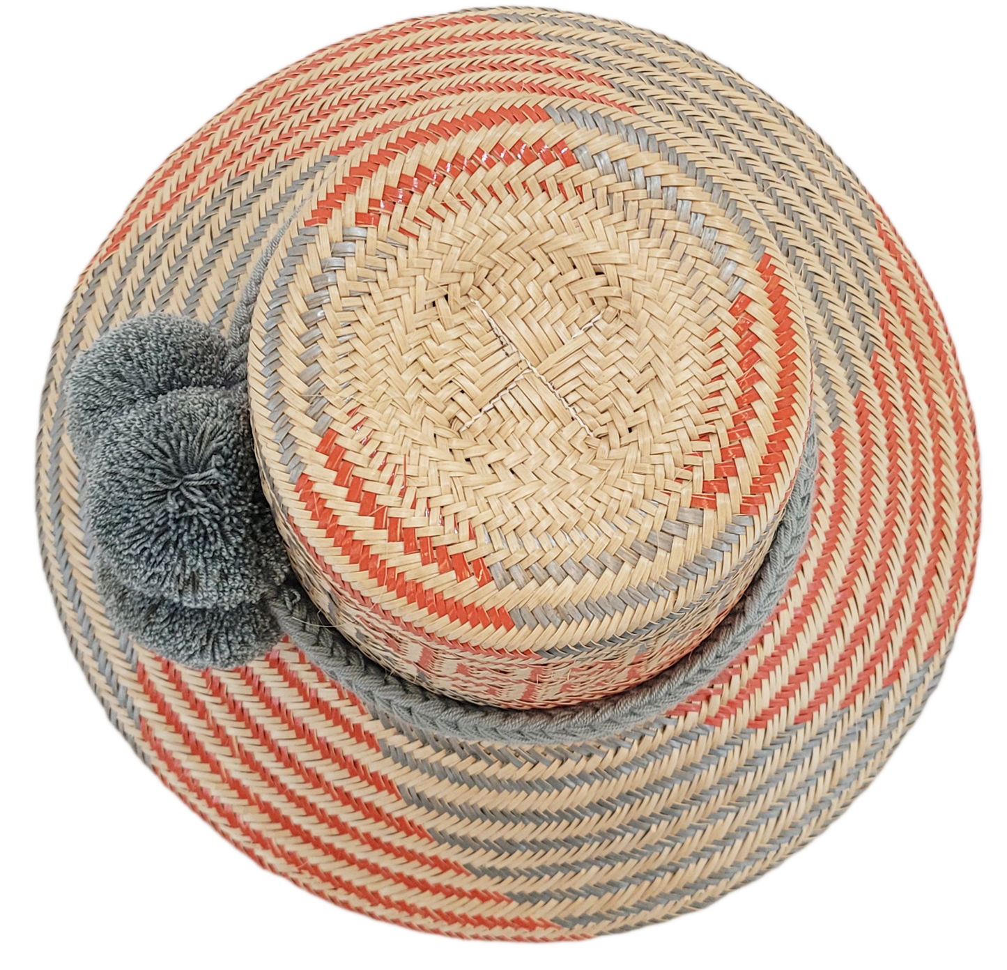 "Handmade Wayuu hat crafted from Iraca palm fibers, adorned with culturally significant pompoms, showcasing unique Wayuu craf