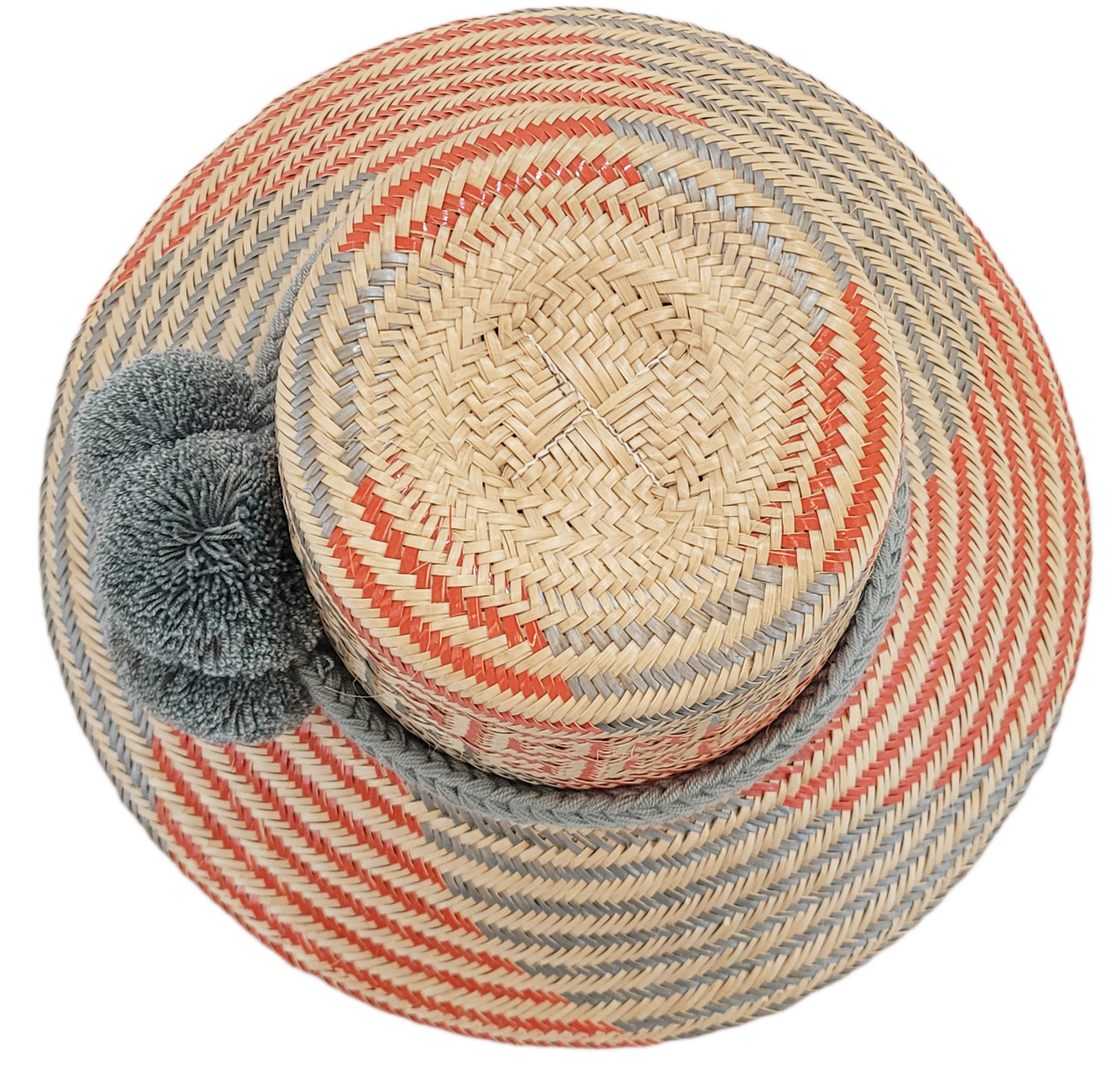"Handmade Wayuu hat crafted from Iraca palm fibers, adorned with culturally significant pompoms, showcasing unique Wayuu craf