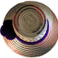 "Handmade Wayuu hat crafted from iraca palm fibers, featuring vibrant colors and intricate patterns by Wuitusu artisans."