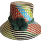 "Handmade Wayuu hat crafted from vibrant Iraca palm fibers, adorned with culturally significant pompoms for sun protection an
