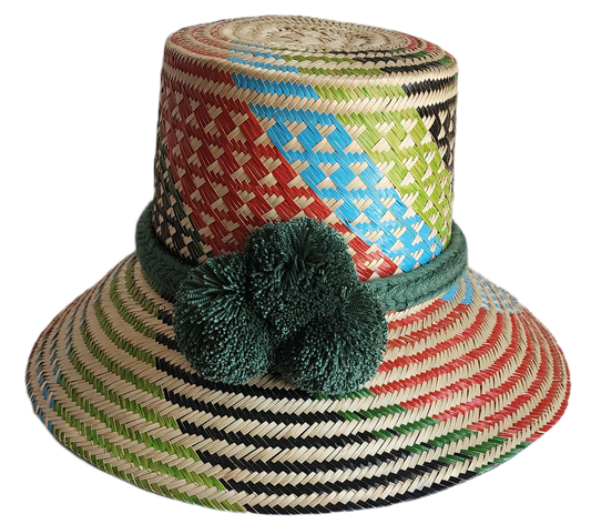 "Handmade Wayuu hat crafted from vibrant Iraca palm fibers, adorned with culturally significant pompoms for sun protection an