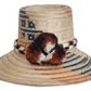 Handmade Wayuu straw hat with burnt orange and navy tribal design