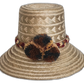 Handmade Wayuu straw hat with earth-tone weave and dark pompoms