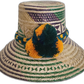 Handmade Wayuu straw hat with green and purple weave and yellow pompoms