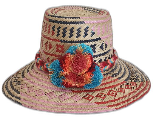 Handmade Wayuu straw hat with pink, red, and navy tribal designs