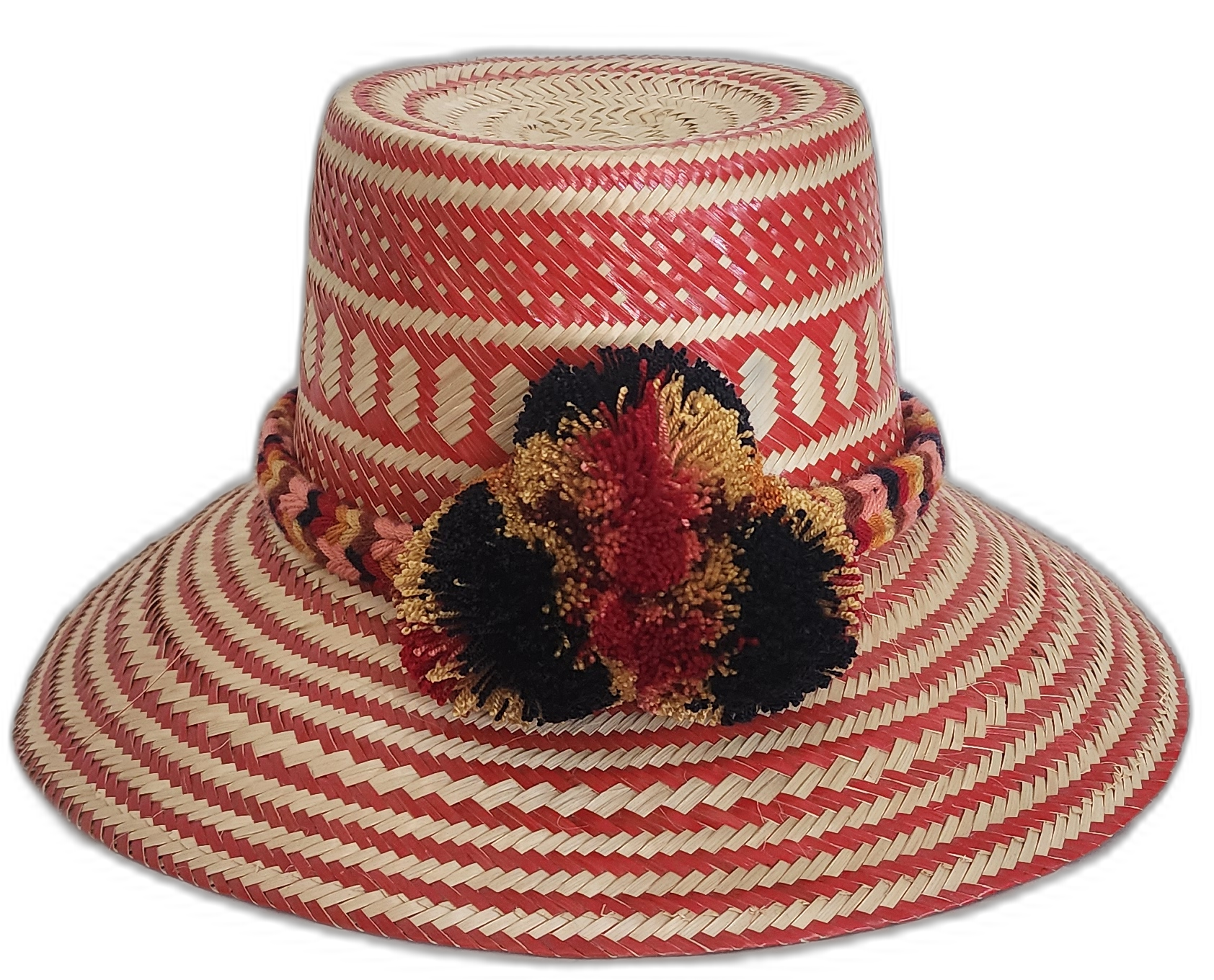 Handmade Wayuu straw hat with red tribal weave and red-black-gold pompoms