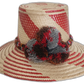 Handmade Wayuu straw hat with bold red diagonal weave and mixed pompoms