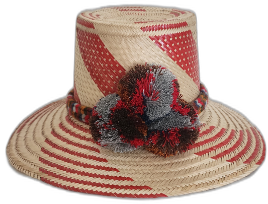 Handmade Wayuu straw hat with bold red diagonal weave and mixed pompoms