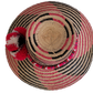 Bohemian straw hat handcrafted with natural Iraca palm and red accents.