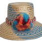 Handmade Wayuu straw hat with sky blue tribal pattern and bright pompoms