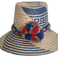 Handmade Wayuu straw hat with blue, red, and green pompoms