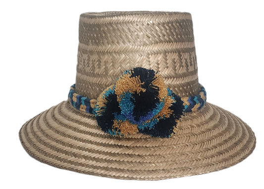 Handmade Wayuu straw hat with a natural Iraca palm weave, decorated with a multicolor braided band and blue, gold, and black pom-poms.