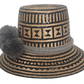 Bohemian artisan straw hat crafted from Iraca palm with black zigzag and diamond patterns, finished with grey pom-poms for a bold yet neutral look.