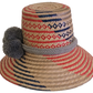 Bohemian-style handmade straw hat with geometric red and blue designs and gray pom-pom accent — artisan-crafted for sun protection and flair.