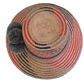 Colorful Wayuu hat for women, with vibrant diamond patterns and soft gray pom-poms — perfect for beach days, festivals, or casual summer wear.