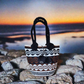 "Handmade Wuitusu Artisan Crochet Bag with vibrant, colorful patterns, showcasing Bohemian charm and Wayuu cultural artistry.