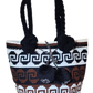 "Handmade Wuitusu Artisan Crochet Bag with vibrant, colorful patterns, showcasing Bohemian charm and Wayuu cultural artistry.