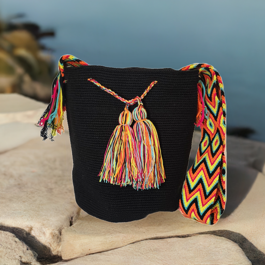 "Handmade Wuitusu crochet bag crafted by Wayuu women, featuring vibrant patterns and colors symbolizing Wayuu culture."