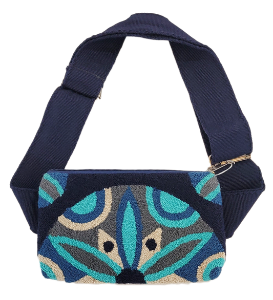 "Handmade Wuitusu Needle Punch Clutch with colorful, intricate patterns by Wayuu artisans, featuring a zip closure and versat