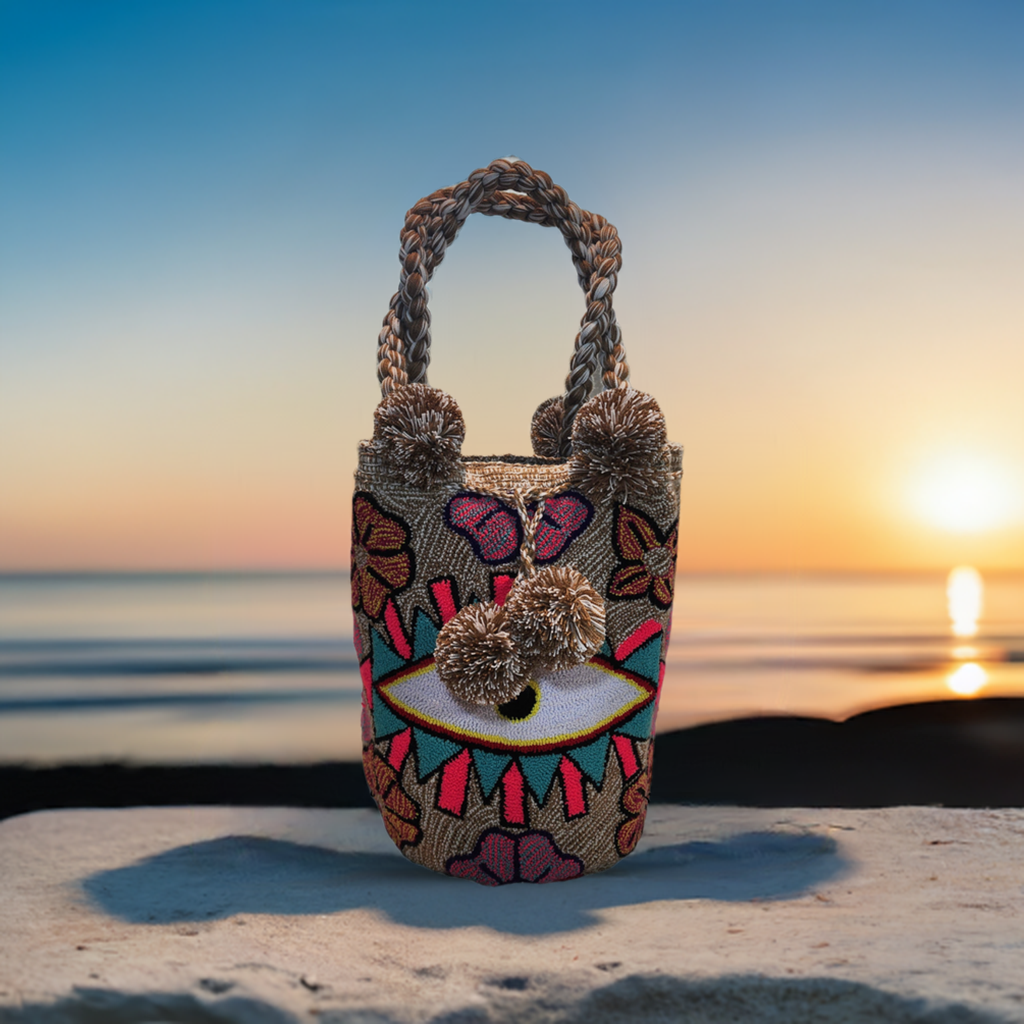 "Handmade Wuitusu Punch Needle Bag with vibrant colors and a boho design, crafted by Wayuu artisans."