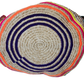 "Handmade Wuitusu Wayuu crochet bag adorned with crystals, showcasing vibrant colors and bohemian charm, supporting Wayuu Tay