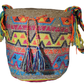 "Handmade Wuitusu Wayuu crochet bag adorned with crystals, showcasing vibrant colors and bohemian charm, supporting Wayuu Tay