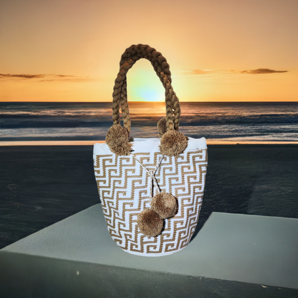 "Handmade Wuitusu Wayuu crochet bag with vibrant patterns, short handle, supporting fair trade and Wayuu community."