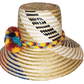 "Handmade Wuitusu Wayuu hat crafted from Iraca palm fibers, adorned with colorful pompoms, reflecting rich Wayuu tribal cultu