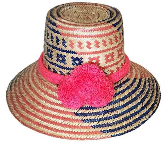 "Handmade Wuitusu Wayuu hat from Iraca palm fiber, adorned with colorful pompoms, showcasing adjustable and versatile styles.