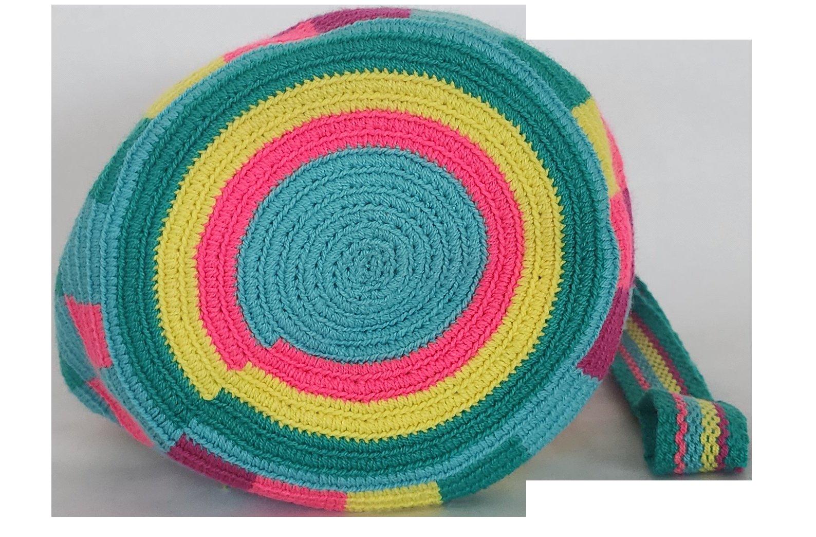 Image of a colorful, handmade crochet Wayuu bag featuring intricate bohemian patterns. This boho crossbody bag, created by indigenous Wayuu artisans from Colombia and Venezuela, showcases vibrant colors and geometric motifs inspired by the Guajira Peninsula. The bag varies in size and includes adjustable straps, making it both stylish and functional for everyday use or beach outings.
