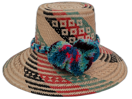 Keilani handmade Wayuu hat with natural, red, black, and green weave and blue pompoms


