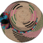 Wayuu straw hat Laila with bright blue and green pompoms and artisan multicolor band


