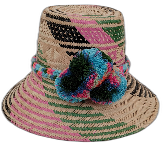 Laila handmade Wayuu straw hat with pink, green, and black weave and bright pompoms

