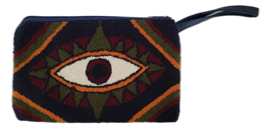 Handmade Wayuu clutch featuring a symbolic eye in boho tribal colors

