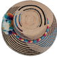 Wayuu hat Lila with geometric palm weave and vibrant handcrafted pompoms


