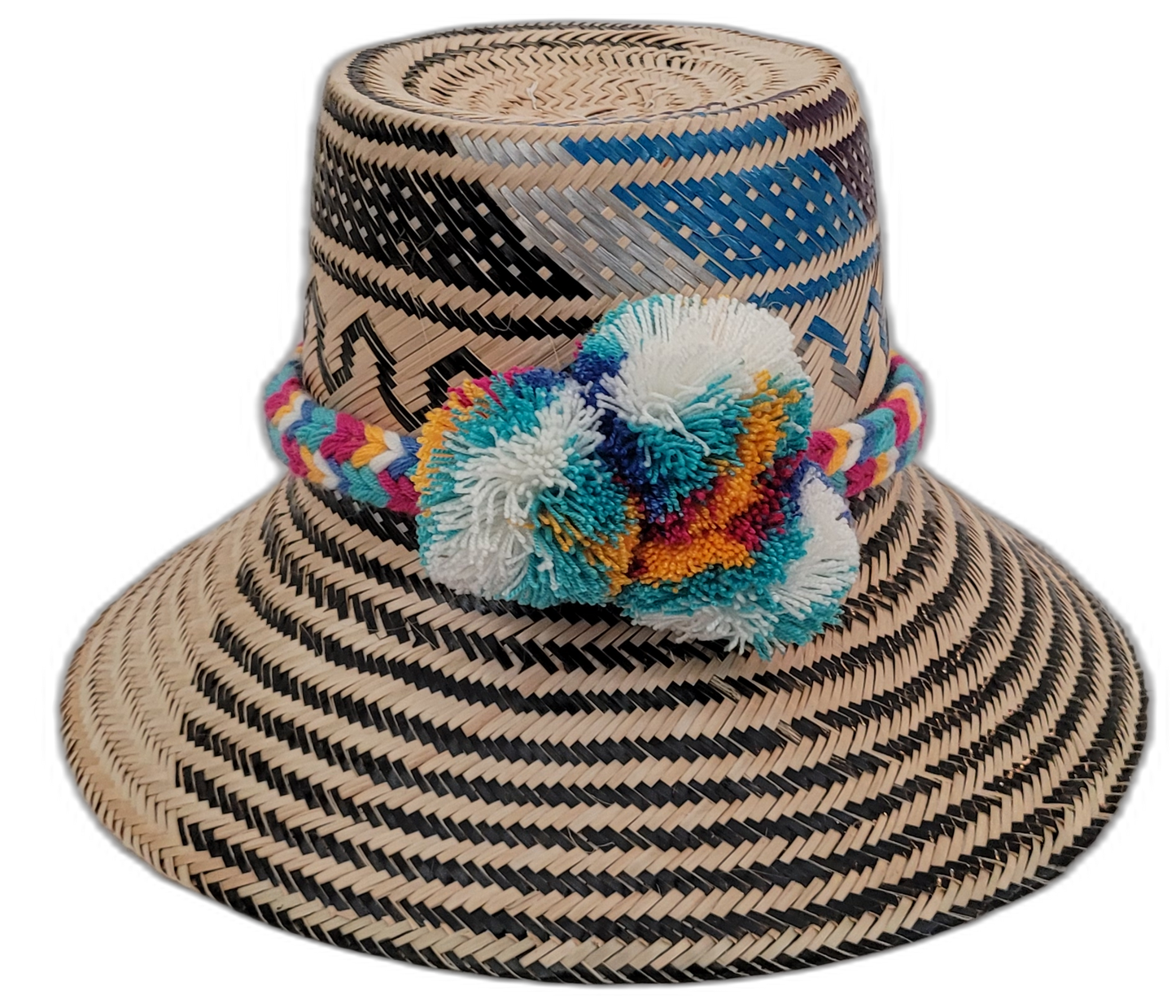 Lila handmade Wayuu straw hat with black, natural, and blue weave and multicolor pompoms

