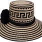Artisan Wayuu hat Lilly with bold black geometric pattern and symbolic black pompom

