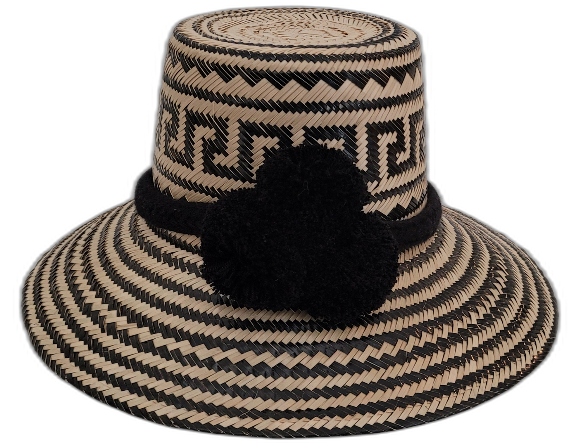 Lilly handmade Wayuu straw hat with natural and black palm fiber and large black pompoms

