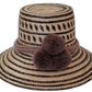Lola handmade Wayuu straw hat in dark brown and natural palm with matching pompoms

