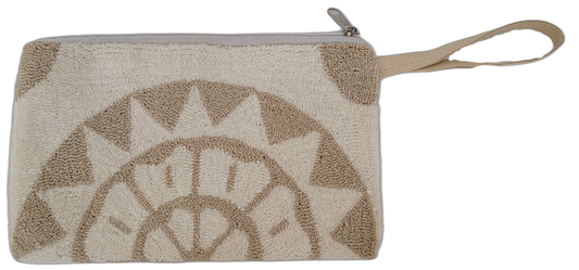 Bohemian punch needle clutch with minimalist sunburst pattern. Handcrafted by Wayuu artisans in cream and beige for timeless, versatile style.