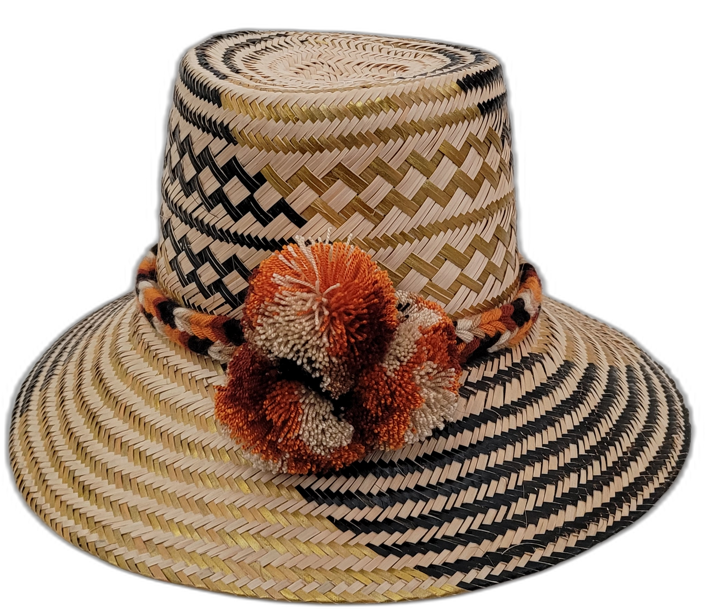 Margo handmade Wayuu straw hat with black and green weave and rust-orange pompoms


