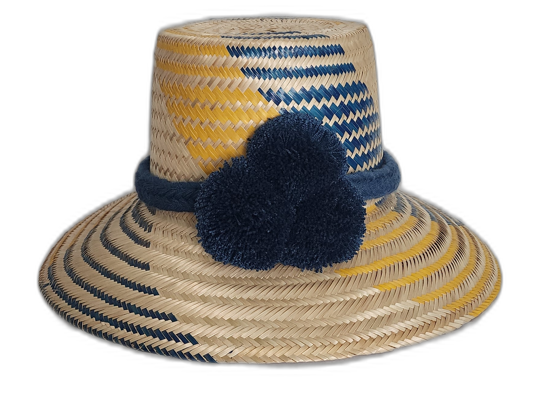 Handmade Wayuu straw hat in yellow and navy with bold navy pompoms.Maria handmade Wayuu hat with yellow and navy diagonal weave and blue pompoms in Bohemian colors