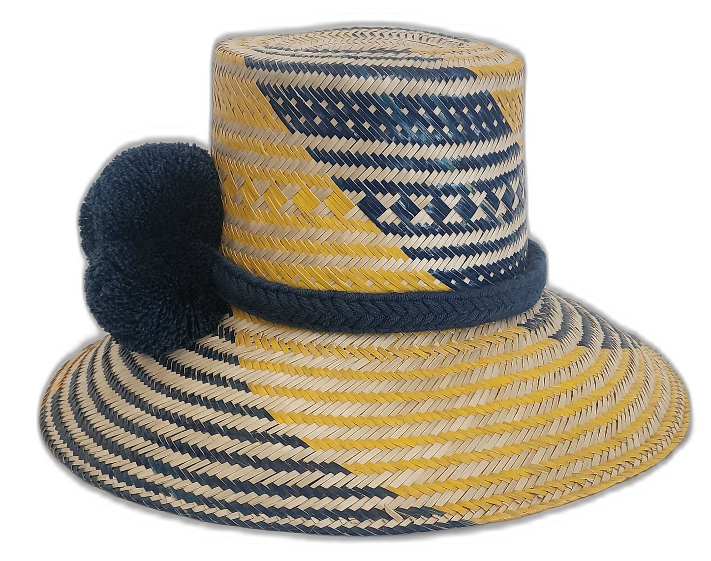 Colorful Boho Chick straw hat featuring traditional Wayuu patterns and navy pompoms.Natural straw hat with navy and yellow stripes and handmade blue pompoms

