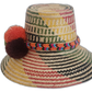 Boho straw hat with green, orange, and burgundy pompoms and vibrant patterns