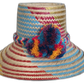Colorful handmade Wayuu hat with vibrant pompom accents

