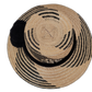 Wayuu hat featuring bold black braiding and tribal-inspired weave